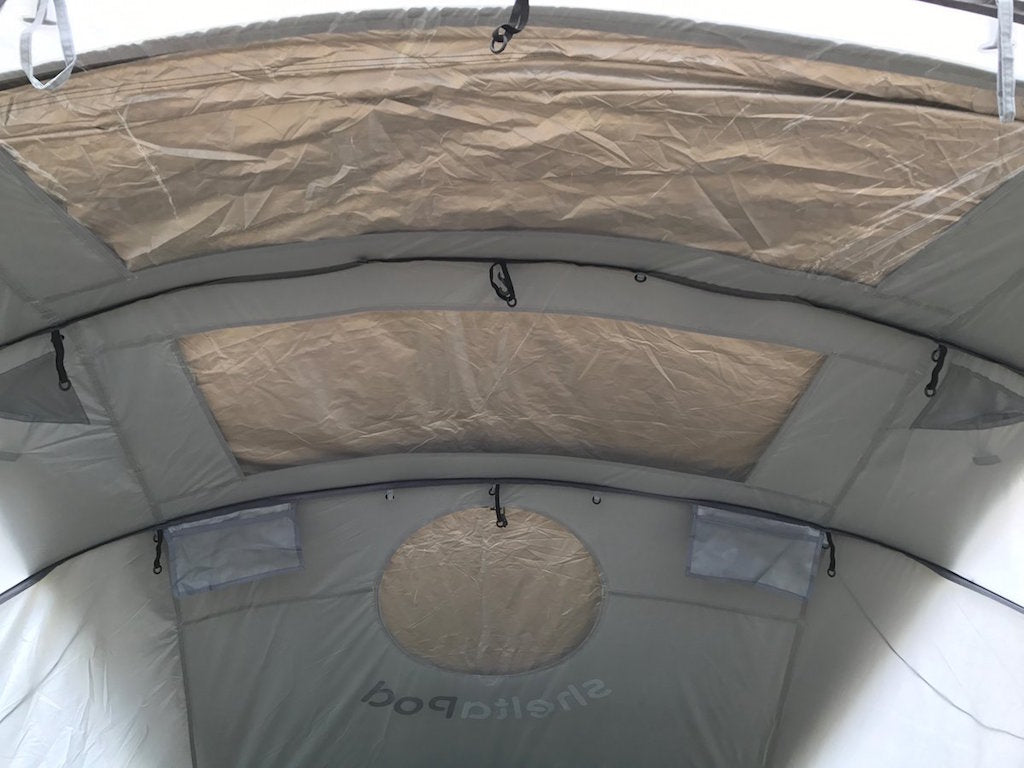 Heat reflective and blackout canopy in one made to fit SheltaPod. Camping equipment that will pack up small and provide a darker and cooler environment inside the tent.